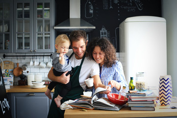 Young family preparing lunch in the kitchen