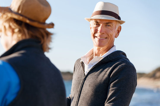 Senior man fishing with his grandson to fish at sea