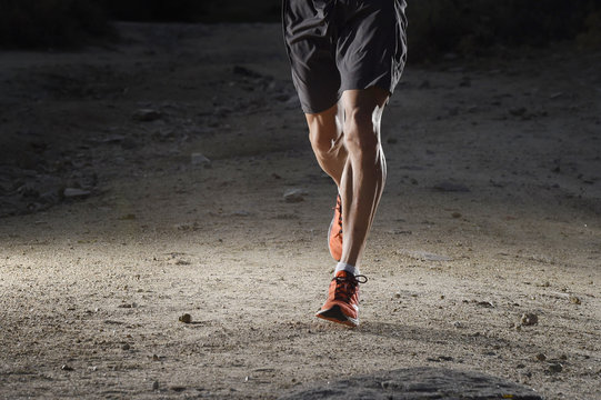 Sport Man With Ripped Athletic And Muscular Legs Running Off Road In Jogging Training Workout At Countryside In Autumn Background