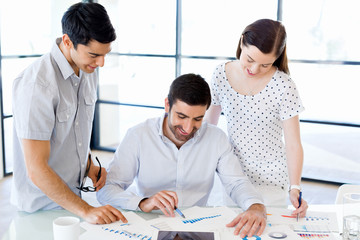 Fototapeta premium Group of happy young business people in a meeting