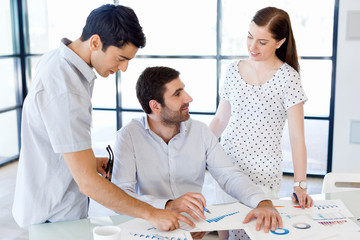 Group of happy young business people in a meeting