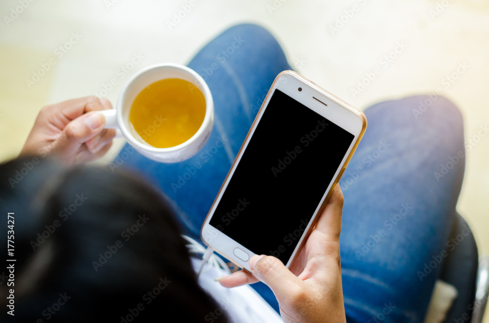 Poster mock up of a man holding device and touching screen