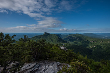 Fototapeta na wymiar Wide View of Hawksbill Mountain and Linnville Gorge with Woman Power Posing