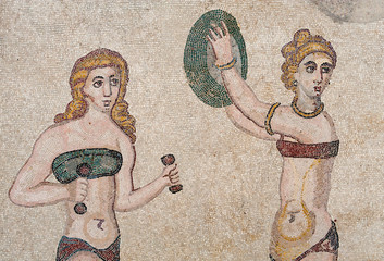 Old roman mosaics: view of figures and motifs in the floor of the old roman Villa del Casale of the 4th century A.C. in the town Piazza Armerina, Sicily