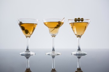 Cocktail with olives on table