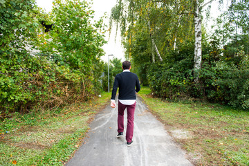man is walking on the forest