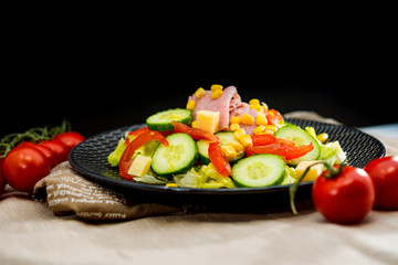 Fresh fruits salad and ham with egg