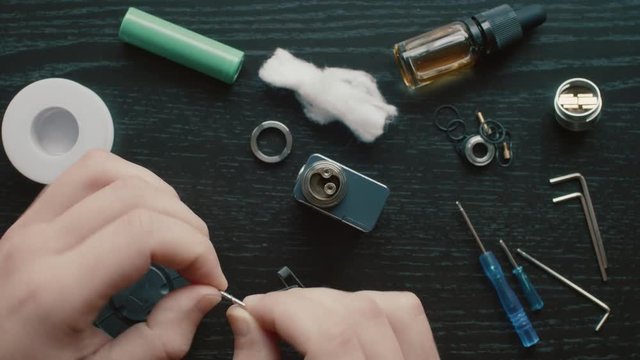 Vape Atomizer Rebuild in Time Lapse using Vaping and eCigarette Tools. Overhead Top Shot