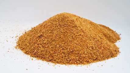 yellow golden of corn ddgs, distillation dried grains soluble onwhite background, raw material of...