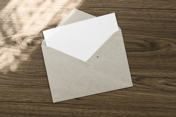 Craft envelope and post card on the wood desk