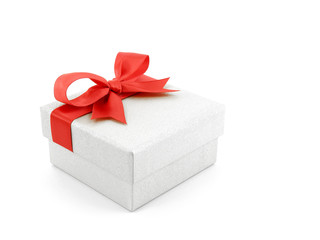 single luxury grey cardboard gift box with red ribbon tied bow isolated on white