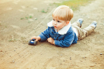 a boy plays in the sand