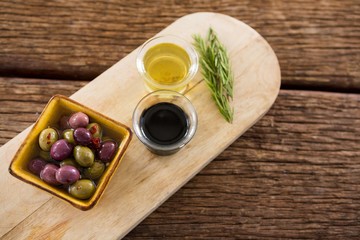 Marinated olive, rosemary with olive oil and balsamic vinegar on