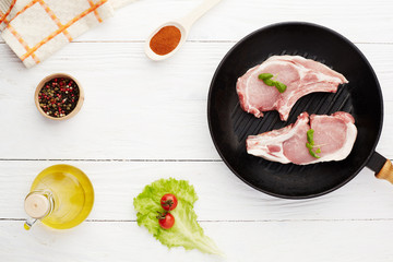 Raw pork meat chops copy space top view