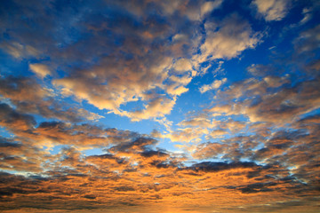Clouds illuminated from below the sun