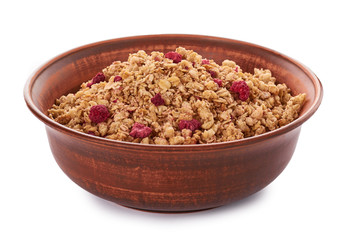 homemade granola with dried fruits in ceramic jar isolated on white background