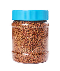 healthy buckwheat grains in plastic bottle isolated on white background