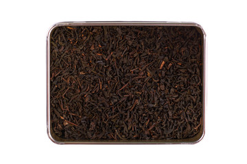 dry black tea leaves in box isolated on white background
