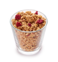 homemade granola with dried fruits in glass cup isolated on white background