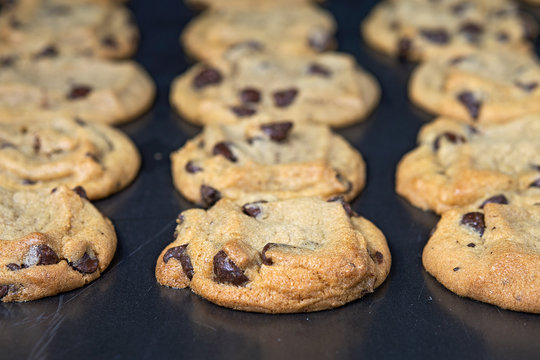 close up of homemade chocolate chip cookies on baking sheet