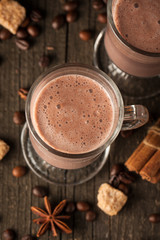 Chocolate, coffee, milk, banana shake on wooden background. Smoothie with cookies. Milkshake. Protein diet. Healthy food concept.