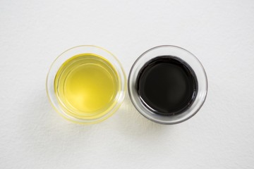 Green and purple olive oil in bowl