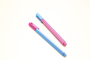 pink and blue pens