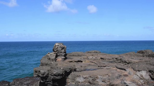 La Roche qui Pleure in Mauritius creates a  illusion as surging waves recede on the cliff. 