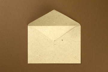 Envelope and postcard on brown backgroun