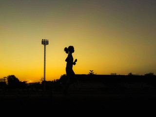 Silhouette teen age run together  track.
