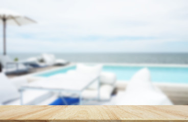 Table top with tables and chairs in sea view.