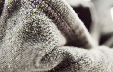 Black wrinkled pile of cotton cloth