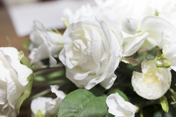 White roses wedding bouquet of flowers shot close up with a shallow depth of field at a tradtional English Wedding