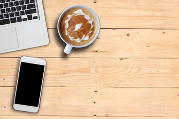 Mock up cell phone and hot art coffee and keyboard of laptop on plank wooden table, copy space