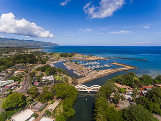 Aerial view of Haleiwa boat harbor, Anahulu river bridge and Ka'ena point  - obrazy, fototapety, plakaty