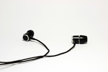 black ear buds isolated on white background