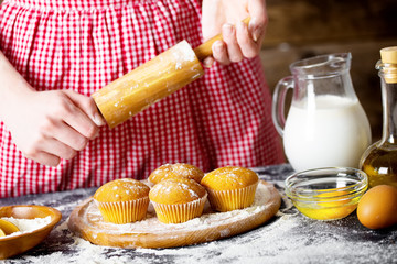 Making dough by female hands at bakery