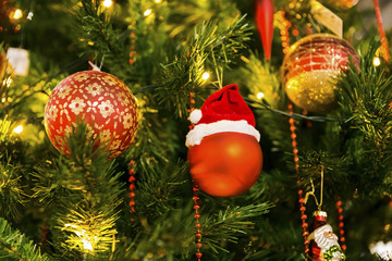 red christmas ball with christmas hat