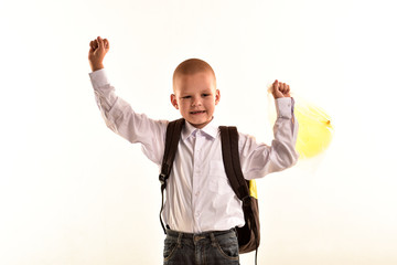 Boys from the village gather in the first grade of school and try on the school uniform and backpack