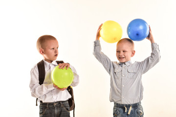 Boys from the village gather in the first grade of school and try on the school uniform and backpack