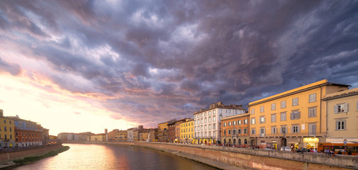 scenic sunset on river in Pisa