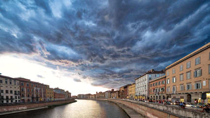 scenic sunset on river in Pisa