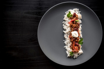 Minced lamb with white rice served on the plate,blank space