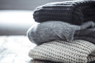 Fototapeta na wymiar stack of cozy knitted sweaters