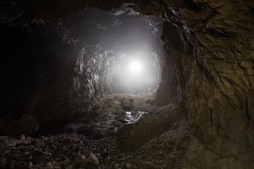 Underground quartz ore mine shaft tunnel with backlight