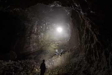 Underground quartz ore mine shaft tunnel with backlight