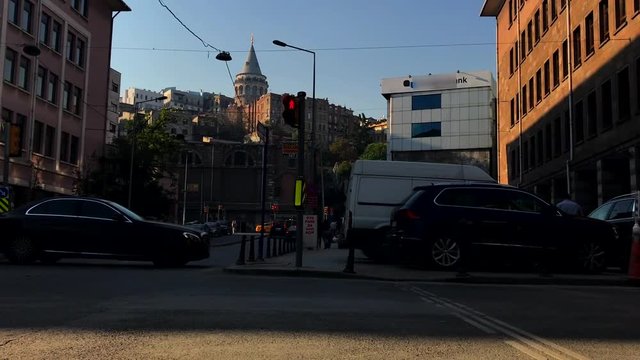 "Istanbul cityscape with Galata Tower and people and vehicles"