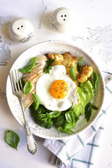 Dinner bowl with meat,fried egg and vegetables.Top view.