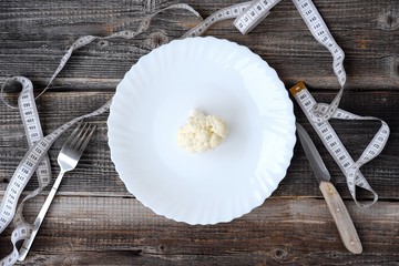 Cauliflower in plate for the diet on the table