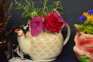 Yellow ornamental ceramic teapot with flowers